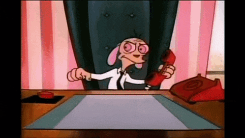 a cartoon dog is sitting at a desk talking on a phone