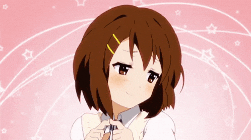 a cute anime girl with brown hair and a tie is making a heart shape with her hands .