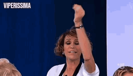 a woman is raising her fist in the air with the words viperissima on the bottom