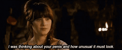 a woman in a purple dress is talking about her penis and how unusual it must look