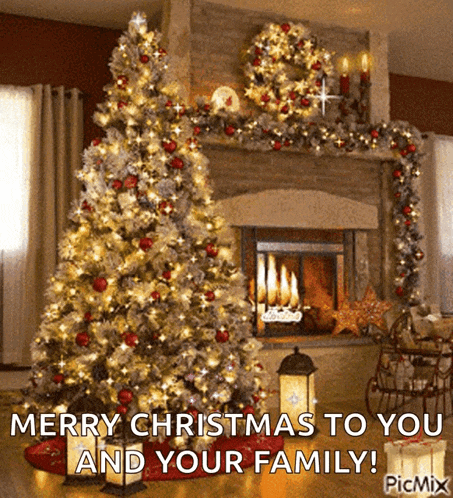 a christmas tree in front of a fireplace with the words merry christmas to you and your family .