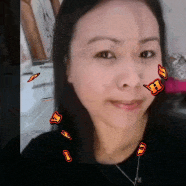 a close up of a woman 's face with butterflies on it