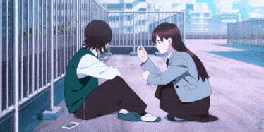 a boy and a girl are sitting next to each other on a sidewalk