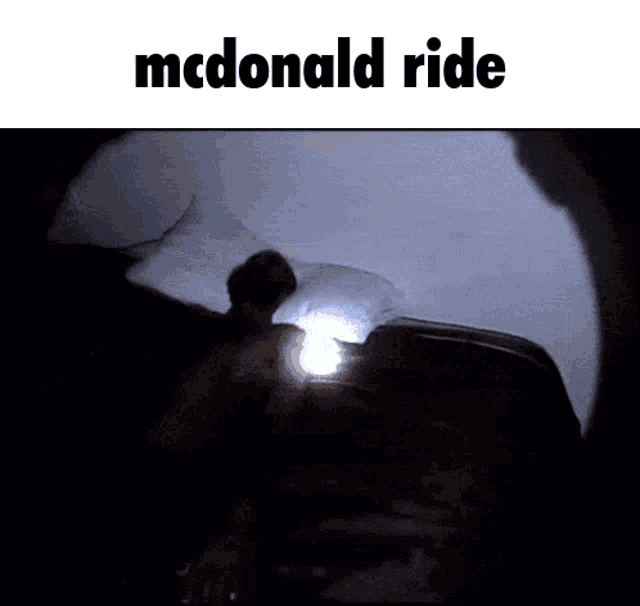 a person laying on a bed with a mcdonald 's ride written above them