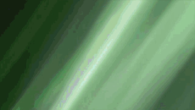 a green background with a glowing light coming out of it .