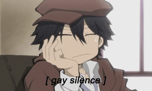 a man in a hat is sitting on a couch with his hand on his face and the words gay silence below him