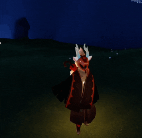 a person in a deer costume stands in a field at night
