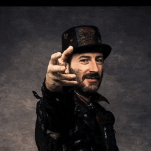 a man with a beard wearing a top hat and a black jacket