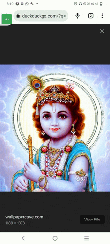 a picture of a baby krishna with a peacock feather crown