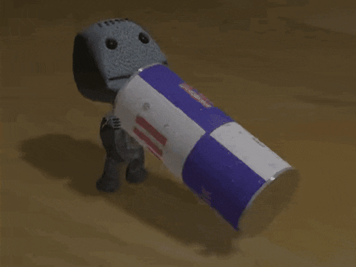 a stuffed animal holding a can that says milk on it