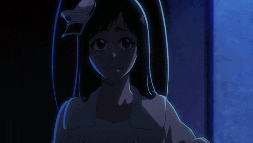 a person 's hand reaches out in the dark