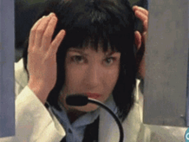 a woman wearing a headset with a microphone on her head