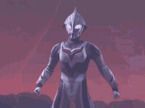 a cartoon character is standing in the dark with a red light coming out of his body .