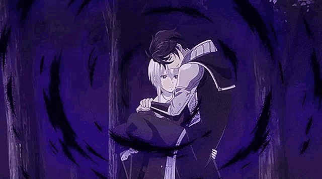 a man is holding a girl in his arms in a forest .