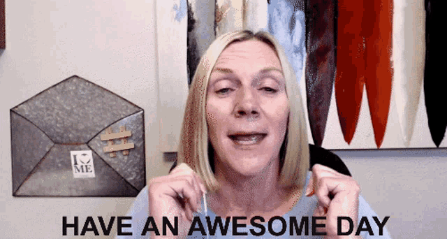 a woman says " have an awesome day " in front of an envelope that says " love me "