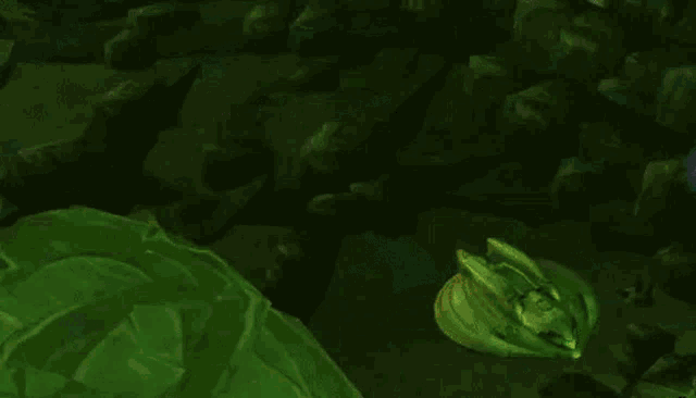 a video game character is holding a green sword and a green jellyfish .