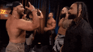 a group of men are standing next to each other with the words gunns up written on the bottom
