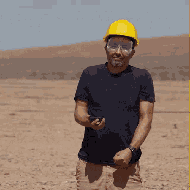 a man wearing a hard hat and safety goggles says oh boy