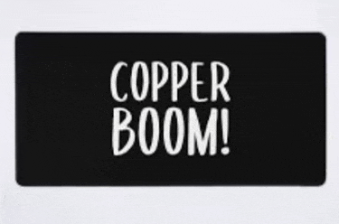 a black mat with white writing that says copper boom