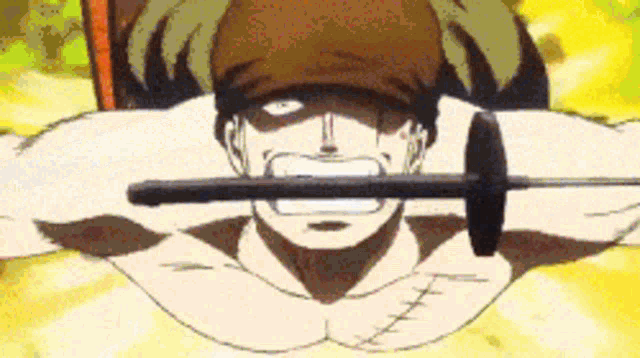a man is holding a sword in his mouth while laying down .