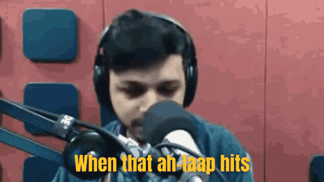 a man wearing headphones speaking into a microphone with the words " when that ah loop hits " written above him