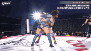 a wrestling match between harukaze and himawari is being shown