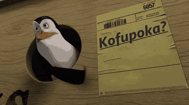 a penguin is sticking its head out of a hole next to a paper that says kofupoka