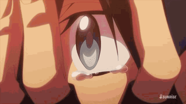 a close up of a person 's eye with a sunrise logo on the bottom
