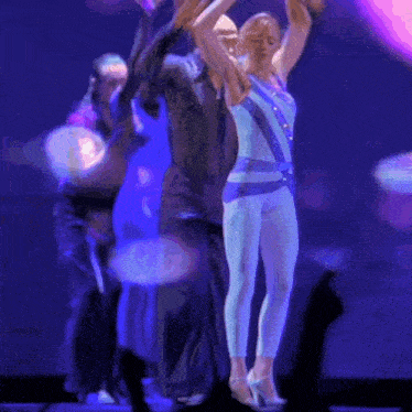 a blurry picture of a woman in a blue and white outfit