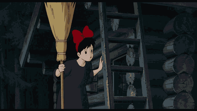 a little girl with a red bow on her head holds a broom