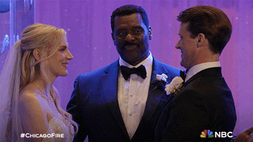 a man in a tuxedo stands next to a bride and groom at their wedding ceremony with the nbc logo visible