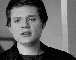 a young man with a serious look on his face