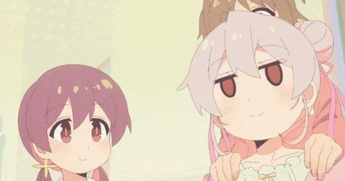 three anime girls are posing for a picture and one has the letter t on her face