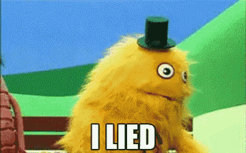 a yellow puppet wearing a top hat says " i lied "