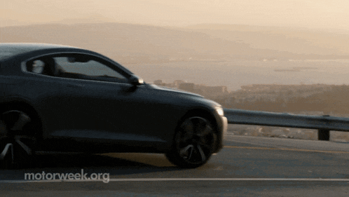 a car is parked on the side of the road with motorweek.org written on the bottom