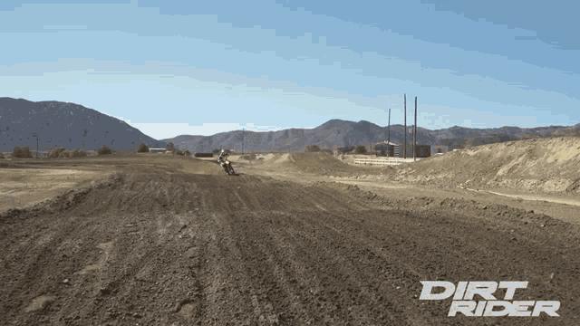 dirt rider is written on a dirt road