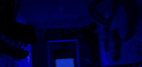 a close up of a person 's face with a yellow light coming out of it