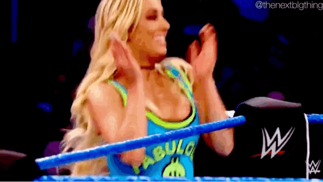 a woman in a wrestling ring wearing a shirt that says " ulo " on it