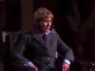 a man with blonde hair is making a funny face