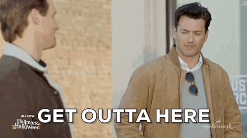 two men are standing next to each other and one of them is saying `` get outta here `` .
