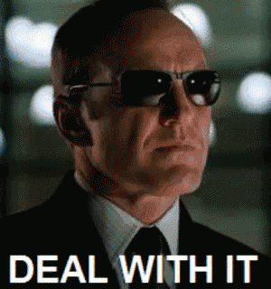 a man wearing sunglasses and a suit has the words deal with it written below him