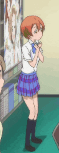 a girl in a plaid skirt is standing in front of a wall