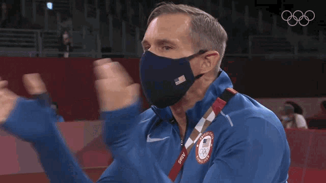 a man wearing a mask and a jacket that says ' united states ' on it