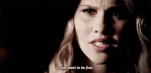 a close up of a woman 's face with the words i just want to be free