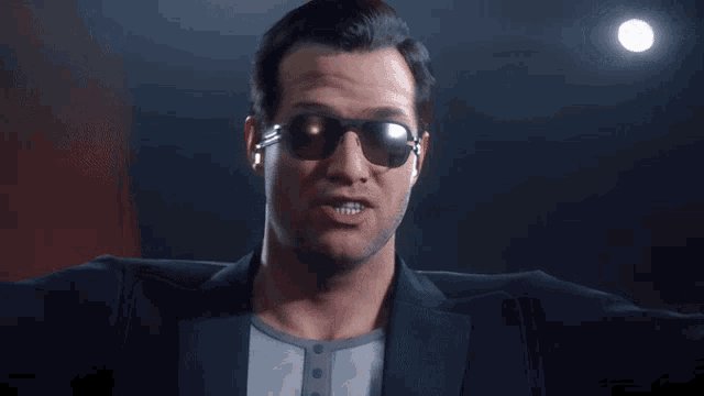 a man wearing sunglasses and a suit is making a face