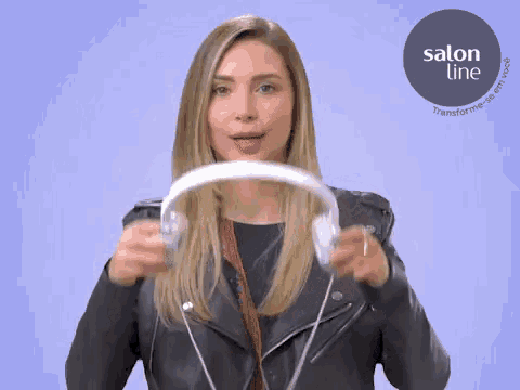a woman wearing headphones with a salon line logo on the bottom
