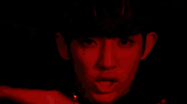 a close up of a person 's face with a tear coming out of it
