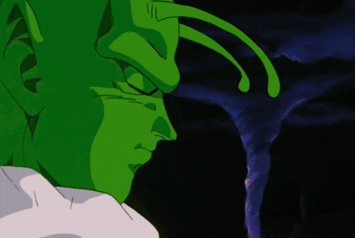 a close up of a green cartoon character with a dark background
