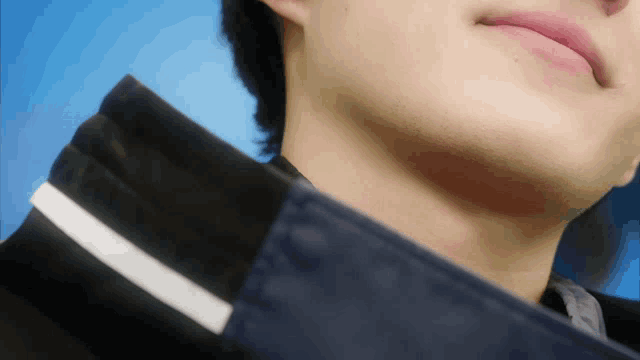 a close up of a man 's neck and chin