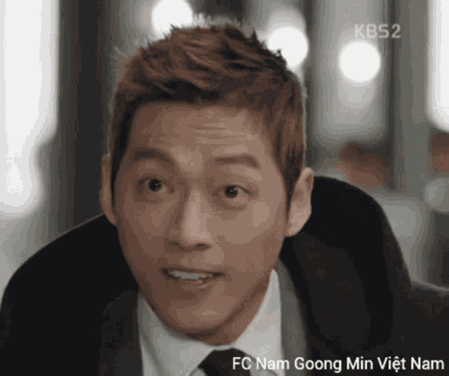 a close up of a man 's face with fc nam goong min viet nam written below him